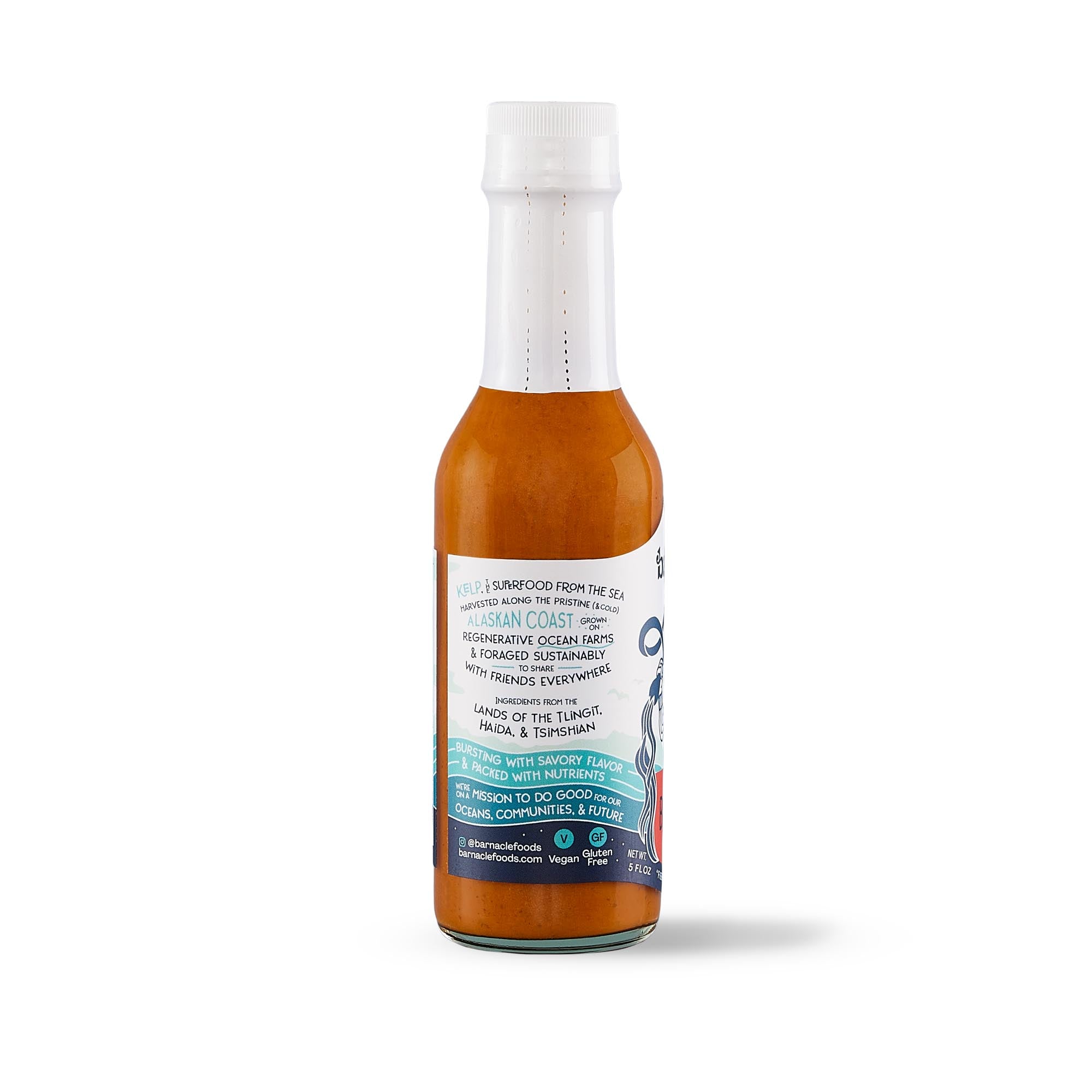 Bottle of hot sauce with a white label on a white background