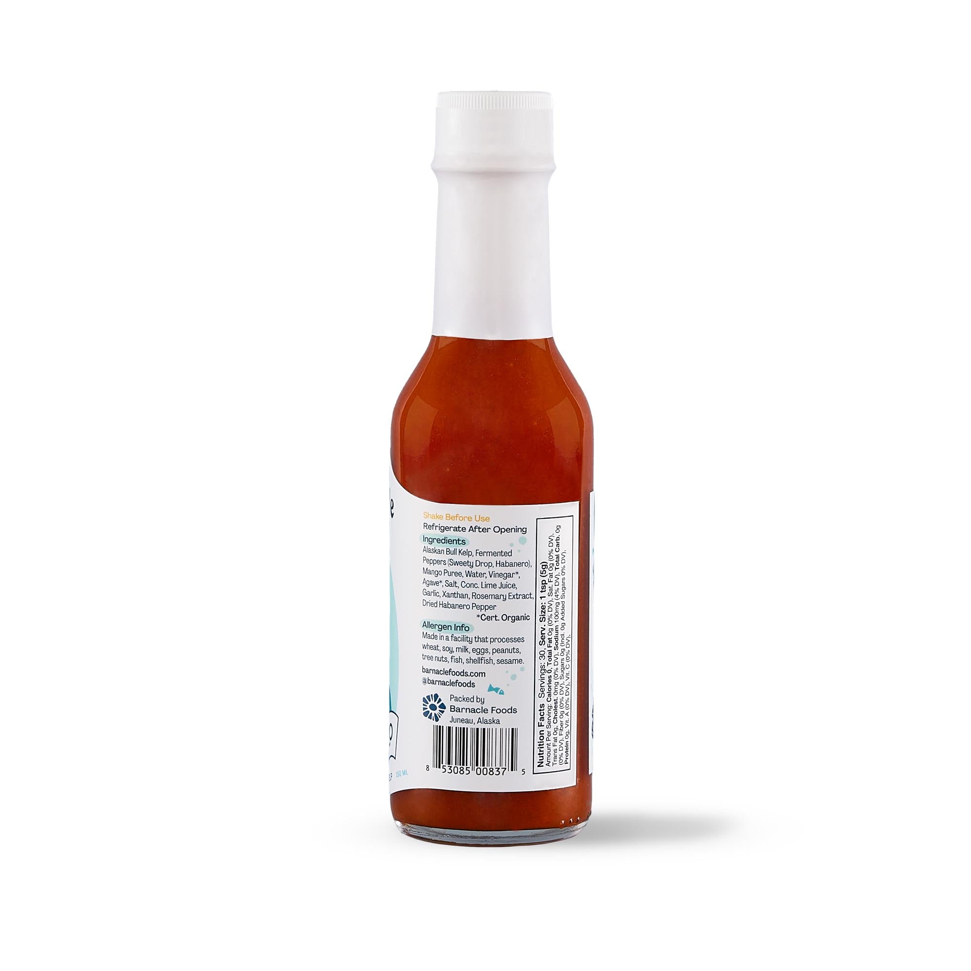 Hot sauce bottle with label on a white background