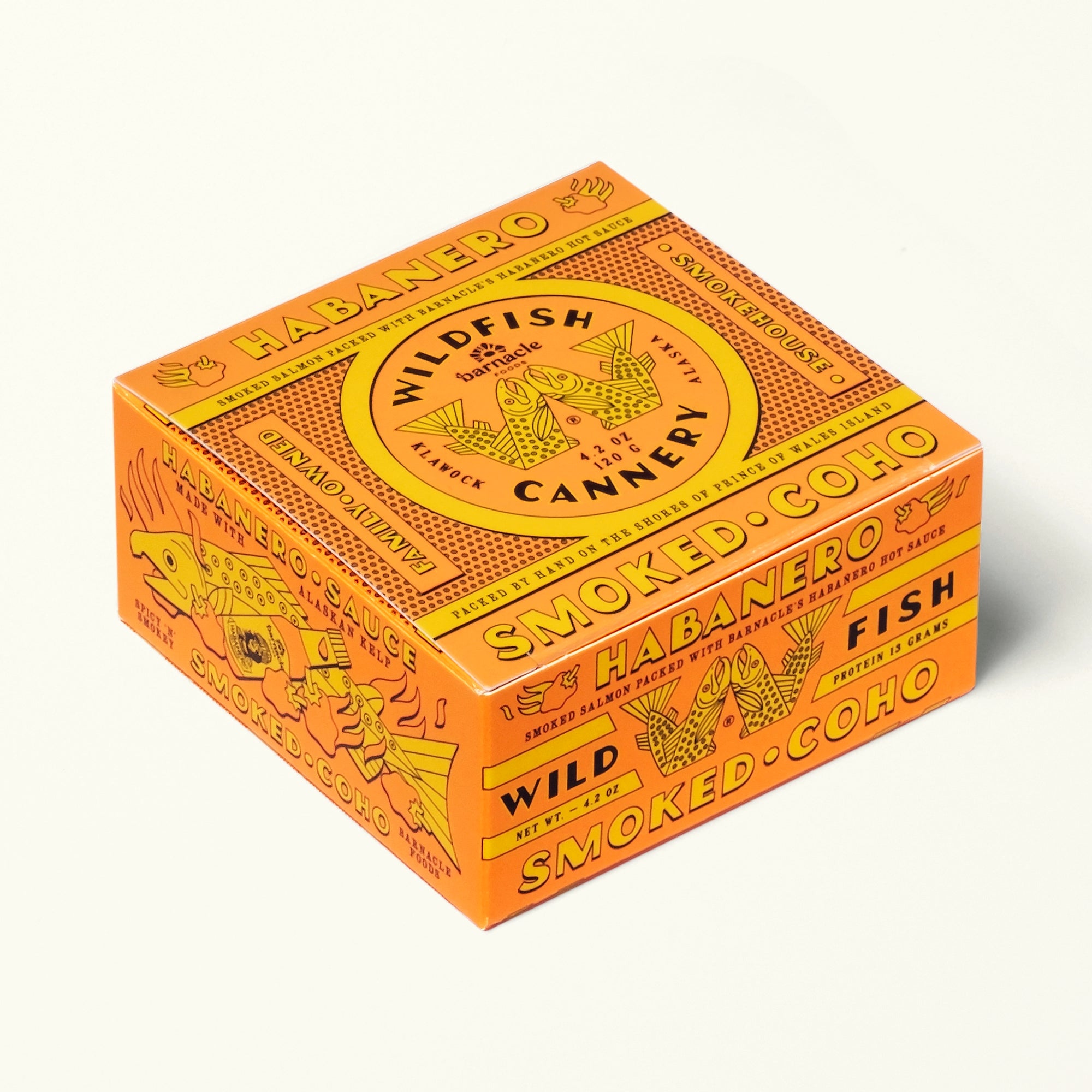 Orange and yellow box of Wildfish Cannery smoked fish on a white background