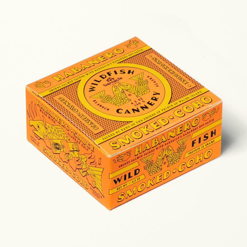 Orange and yellow box of Wildfish Cannery smoked fish on a white background