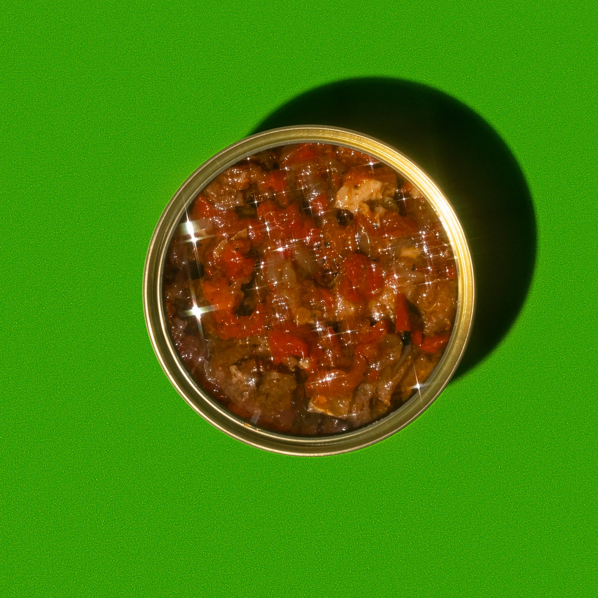 Round container with a lid on a green background