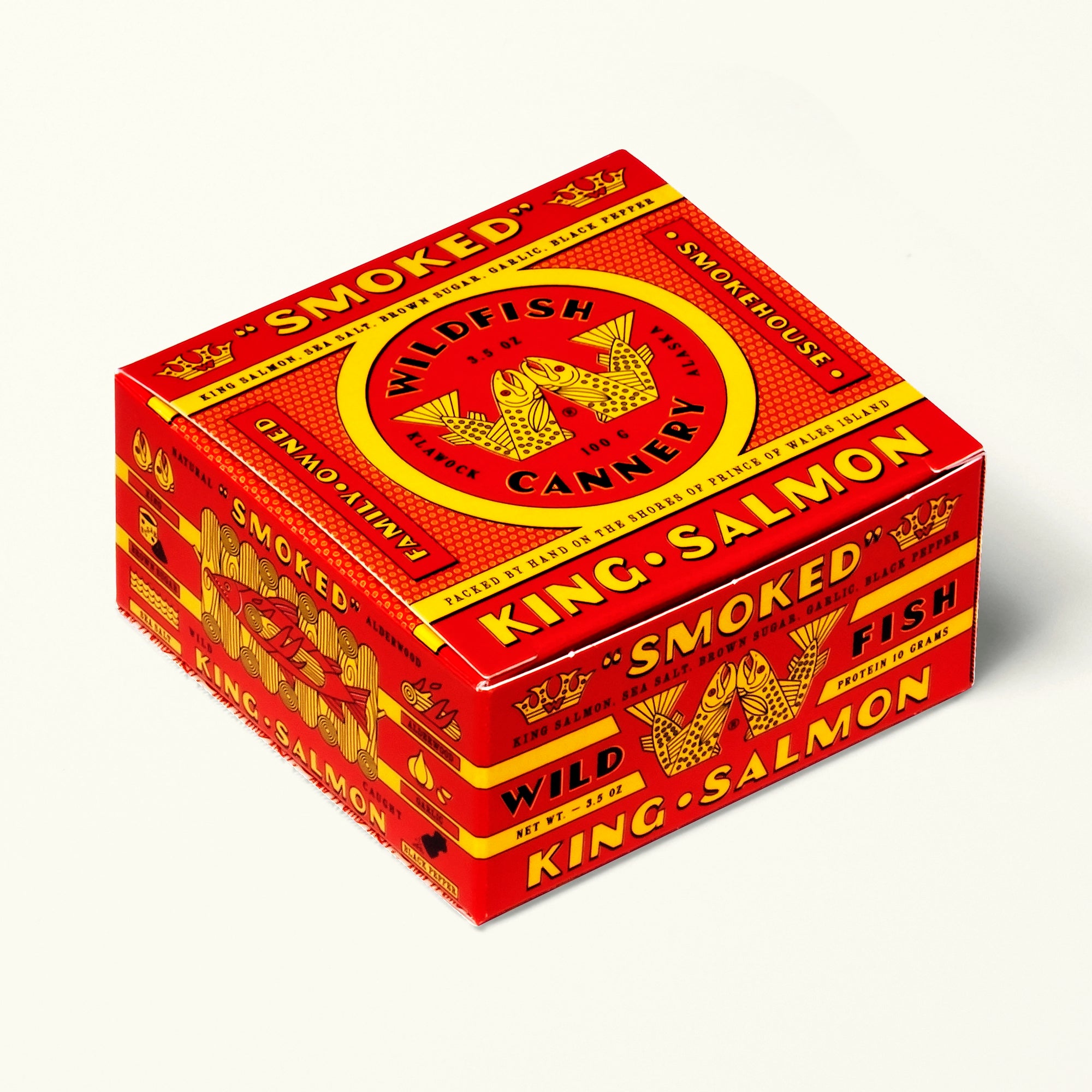Red and yellow box of smoked salmon from Wildfish Cannery on a white background