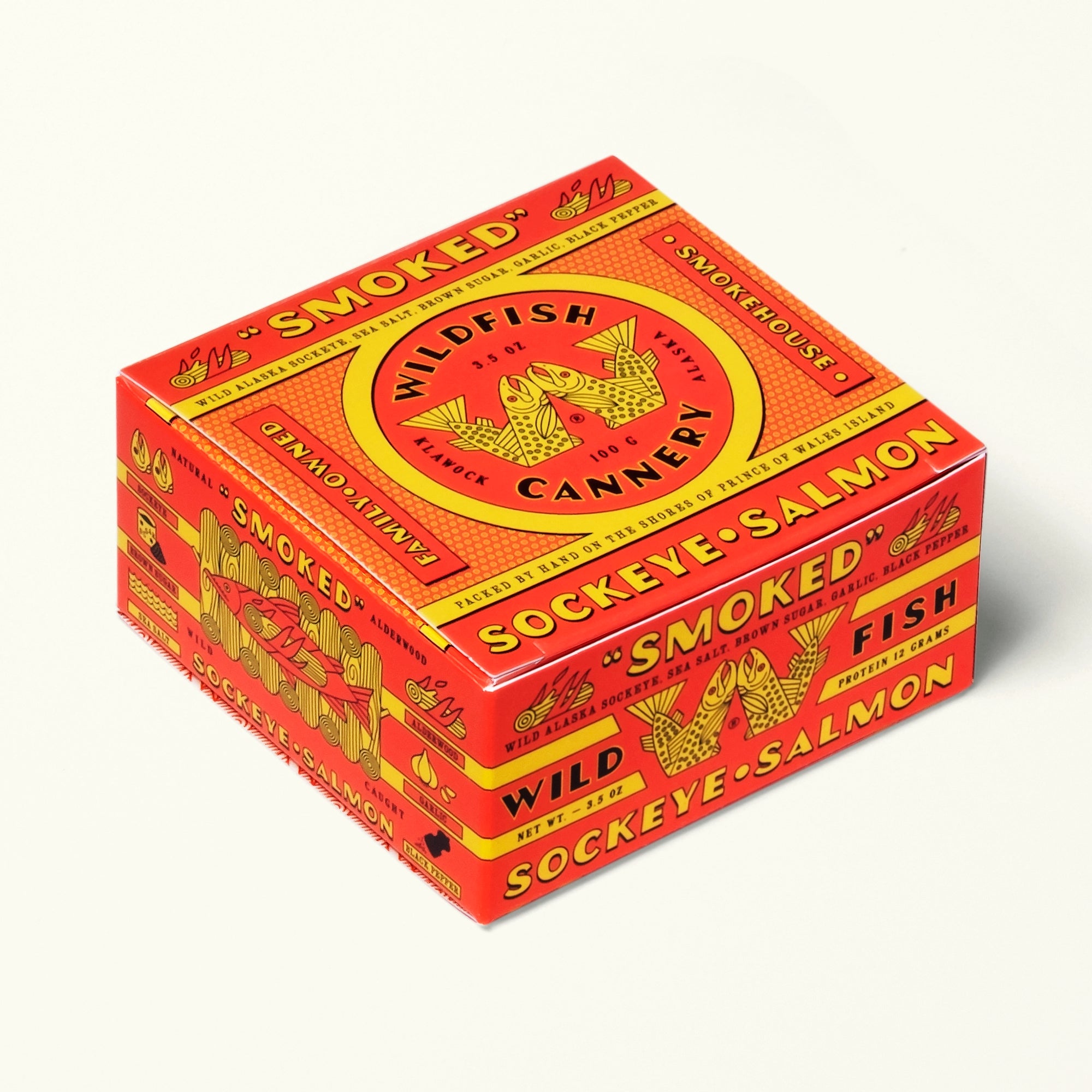 Red and yellow box of Wildfish Cannery smoked sockeye salmon on a white background